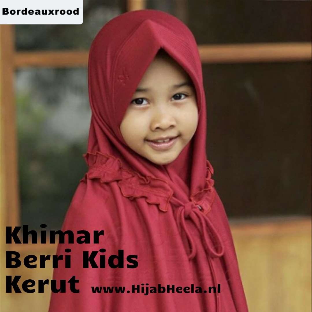 a little girl wearing a red hat and a hat