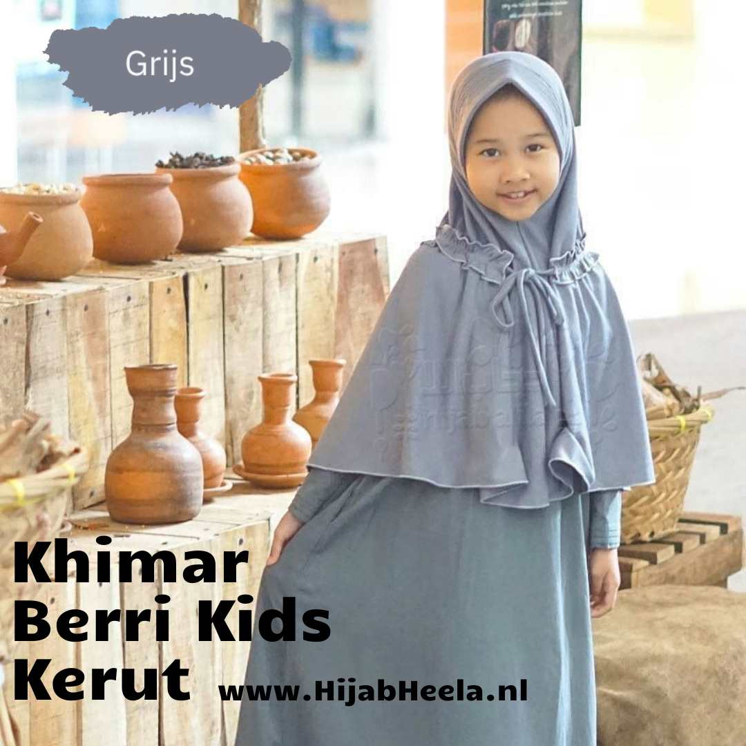 a woman standing in front of a bunch of vases