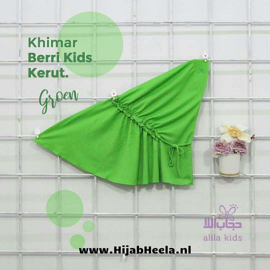 a green umbrella sitting on top of a wall