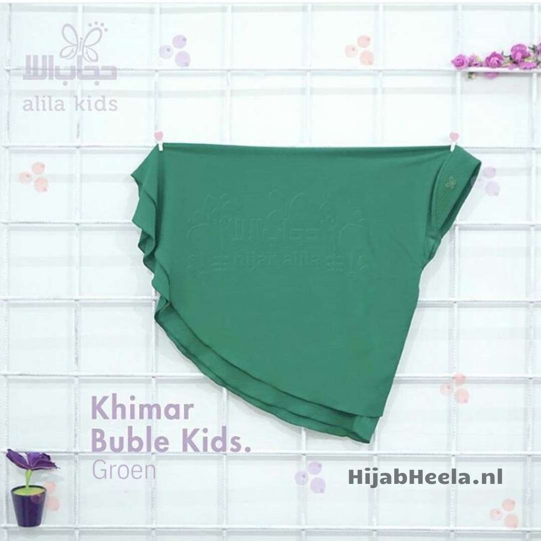 a green umbrella sitting on top of a piece of paper