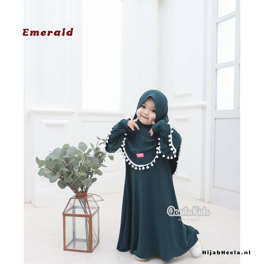 a woman in a dress talking on a cell phone