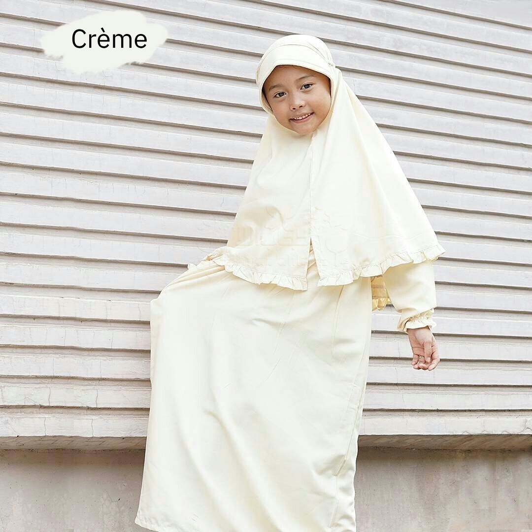 a woman in a white dress standing in front of a house